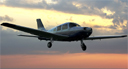 Piper Warrior III landing at dusk